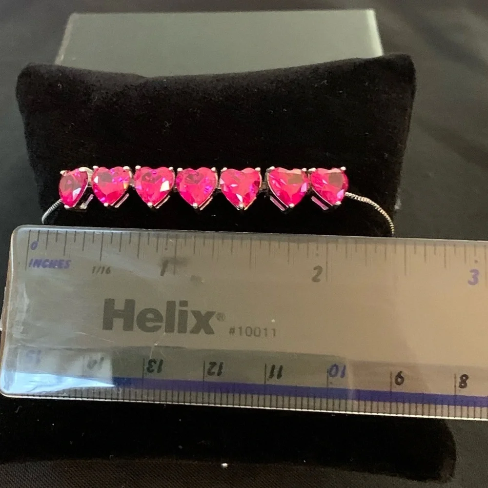 Rhodium over sterling silver lab ruby heart bolo bracelet